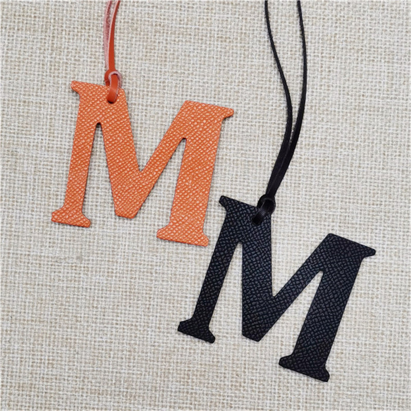 XMESSUN New English Letters M  - огляд і ціна Monogram Keychain Leather